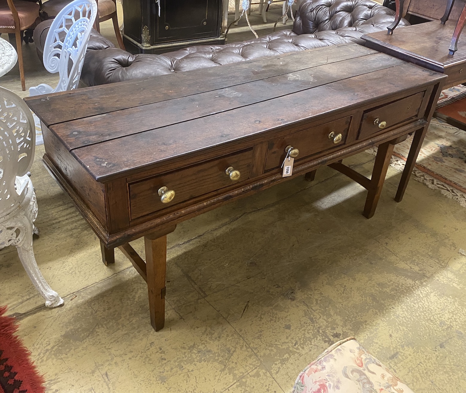 An 18th century oak low dresser on later square tapered legs, width 150cm, depth 50cm, height 70cm